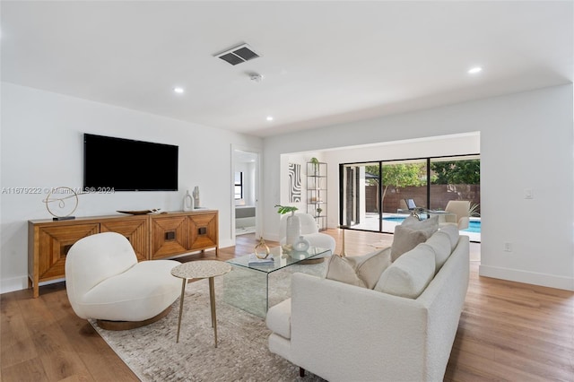 living room with light hardwood / wood-style flooring