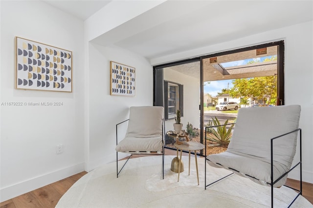 living area with hardwood / wood-style floors