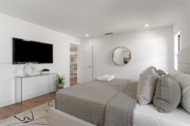 bedroom with light wood-type flooring