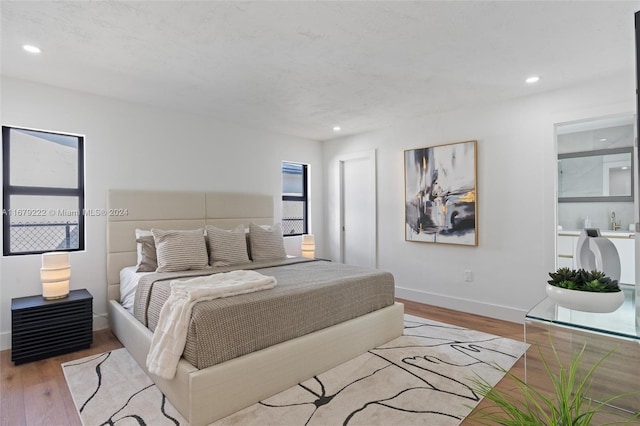 bedroom with light hardwood / wood-style floors