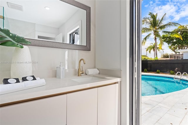 view of pool with sink