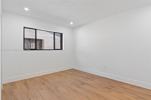 empty room with light wood-type flooring