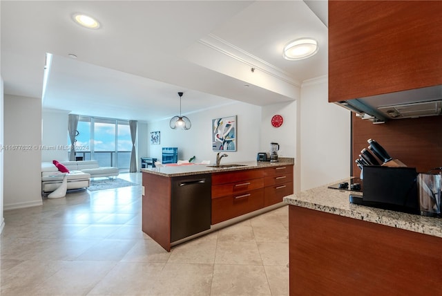 kitchen with light stone countertops, black appliances, sink, and pendant lighting