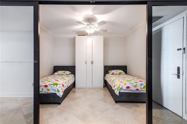 bedroom with ornamental molding and ceiling fan