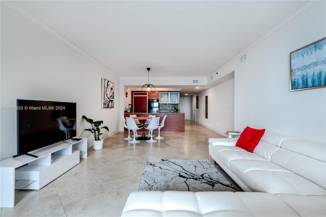 living room featuring crown molding and light tile patterned flooring