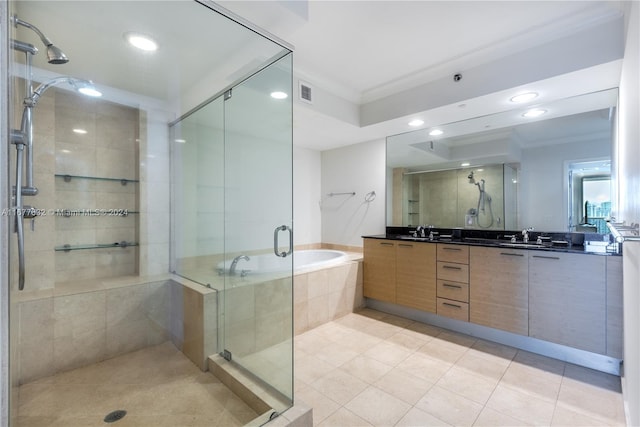 bathroom featuring vanity, tile patterned floors, ornamental molding, and shower with separate bathtub