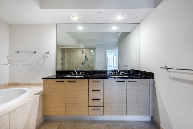 bathroom with vanity, shower with separate bathtub, and tile patterned flooring