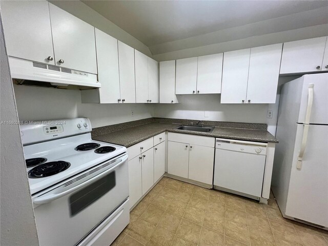 kitchen featuring white appliances, white cabinetry, and sink