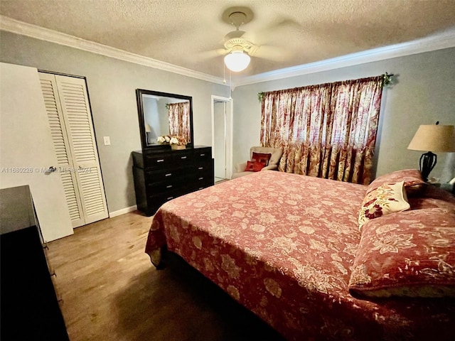 bedroom featuring crown molding, a textured ceiling, carpet, and ceiling fan