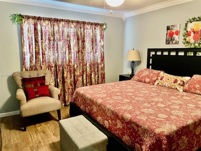 bedroom with ornamental molding and wood-type flooring