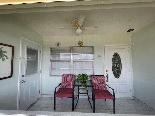 view of exterior entry featuring ceiling fan