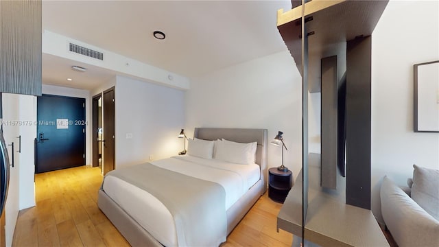 bedroom featuring a closet and light wood-type flooring