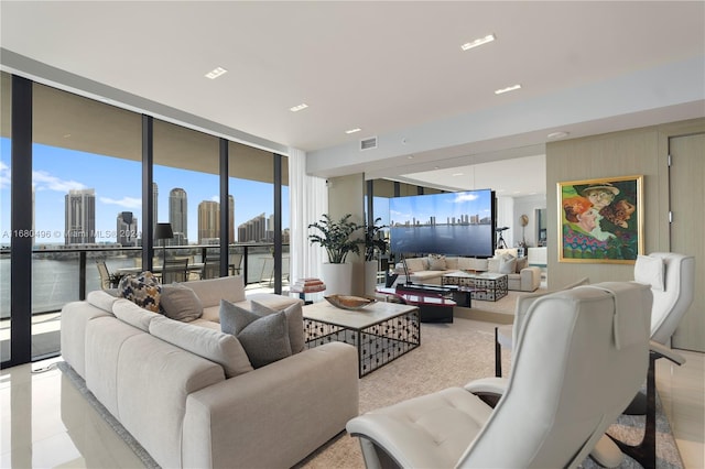 living room featuring a wall of windows and a wealth of natural light