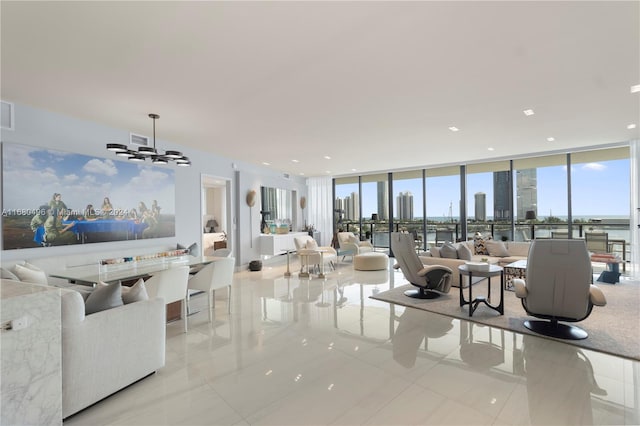 living room featuring floor to ceiling windows, light tile patterned floors, and a chandelier