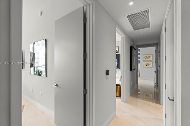 hallway with light tile patterned flooring