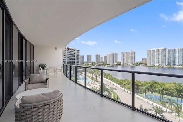 balcony featuring a water view