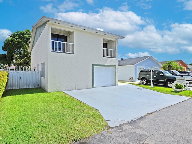 view of property exterior with a garage and a lawn