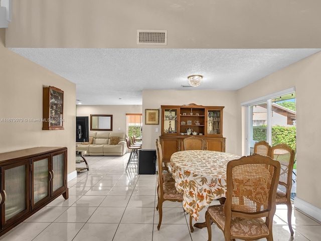 dining space with light tile patterned floors