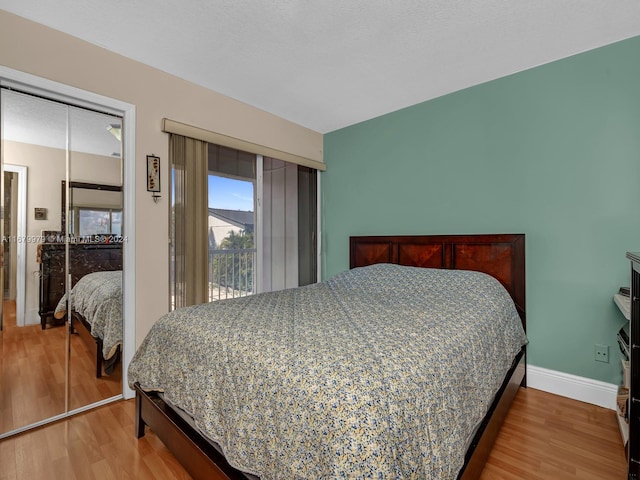 bedroom with a closet and wood-type flooring