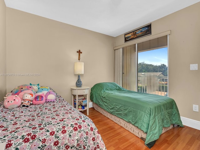 bedroom with hardwood / wood-style floors