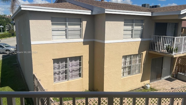 view of property exterior featuring a balcony