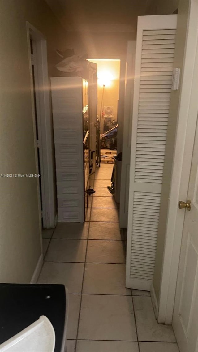 hallway featuring light tile patterned flooring