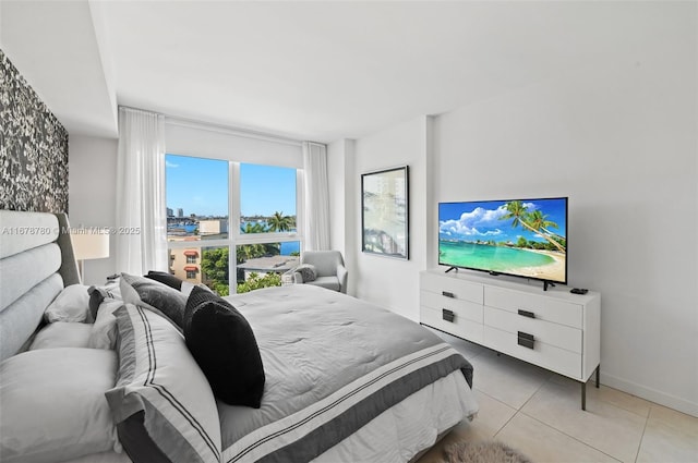 401 N Birch Rd Unit 505, Fort Lauderdale, FL 33304 - bedroom featuring light tile patterned floors and baseboards