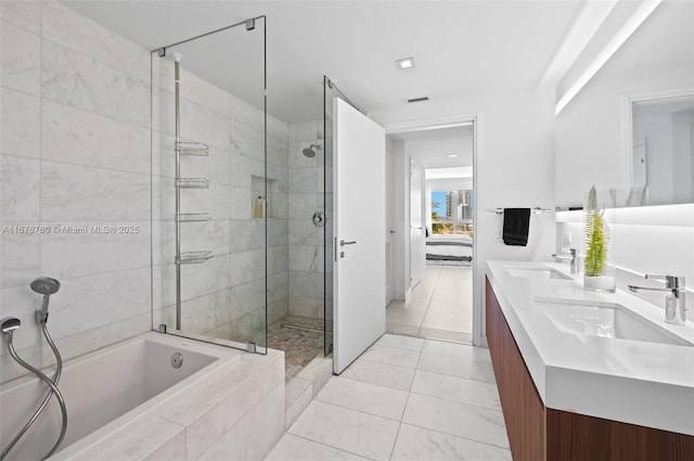 401 N Birch Rd Unit 505, Fort Lauderdale, FL 33304 - bathroom with a garden tub, a stall shower, connected bathroom, and double vanity