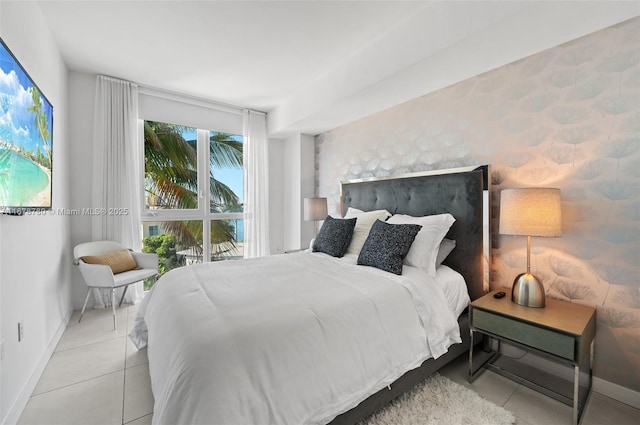 401 N Birch Rd Unit 505, Fort Lauderdale, FL 33304 - tiled bedroom featuring baseboards
