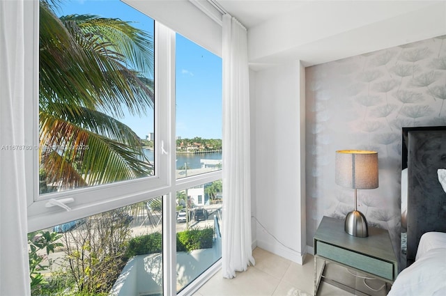 401 N Birch Rd Unit 505, Fort Lauderdale, FL 33304 - interior space with a water view, tile patterned floors, an accent wall, and baseboards