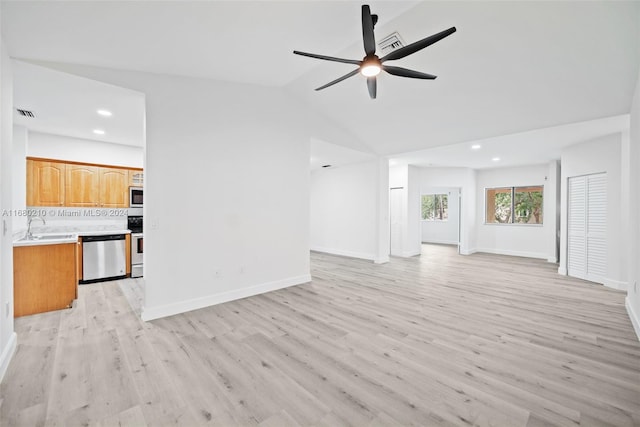 unfurnished living room with light hardwood / wood-style flooring, sink, lofted ceiling, and ceiling fan