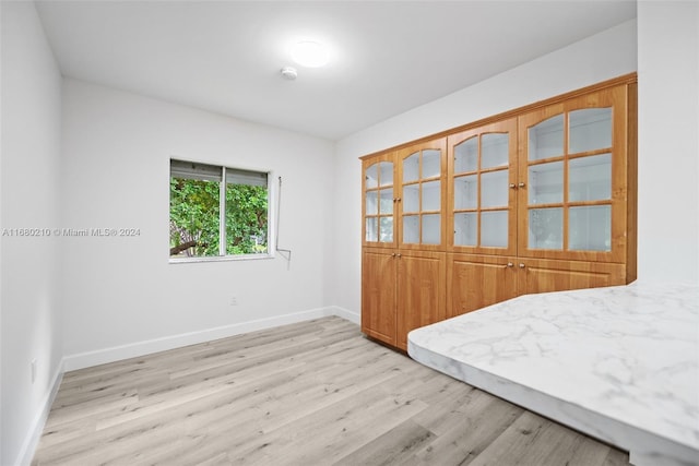 bedroom featuring light hardwood / wood-style floors