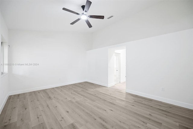 unfurnished room featuring ceiling fan, vaulted ceiling, and light hardwood / wood-style flooring