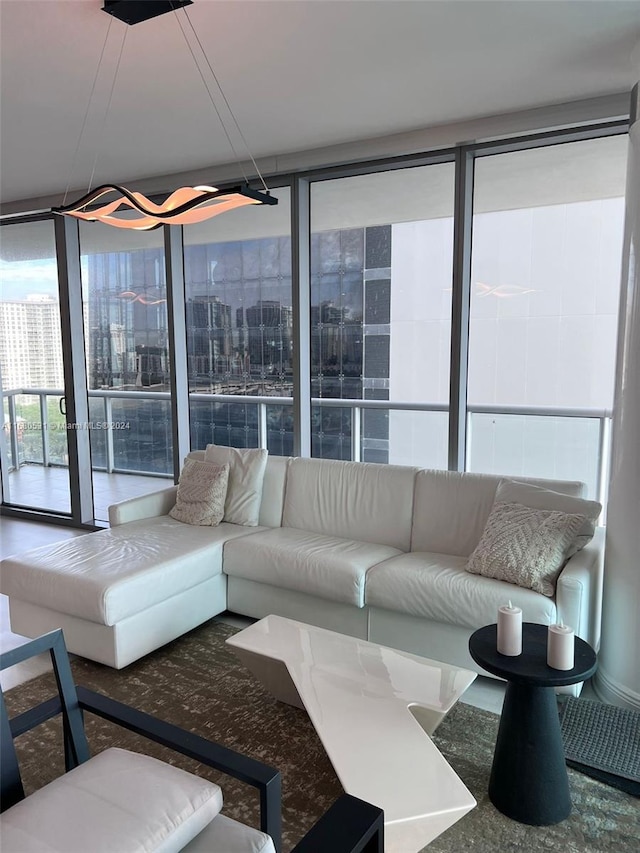 carpeted living room with floor to ceiling windows