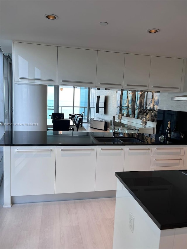 kitchen with sink and white cabinetry