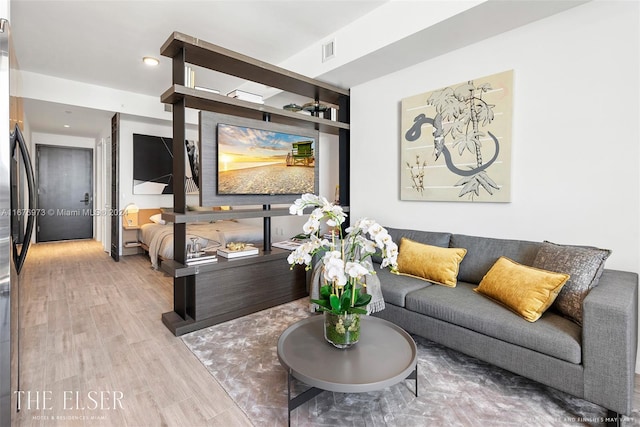 living room with light hardwood / wood-style flooring