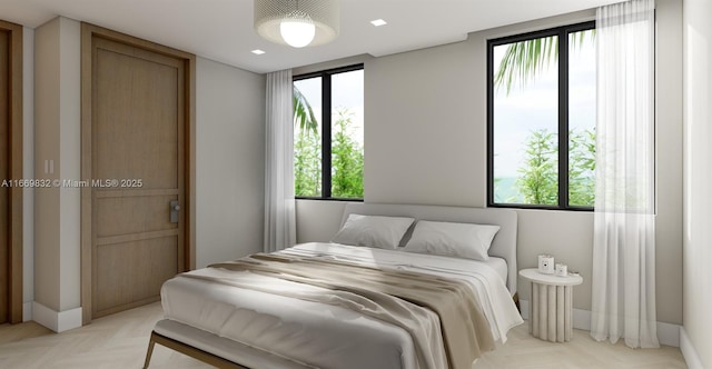 bedroom featuring multiple windows and light parquet floors