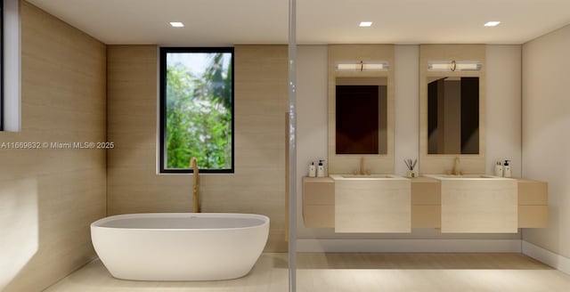 bathroom with vanity and a tub to relax in