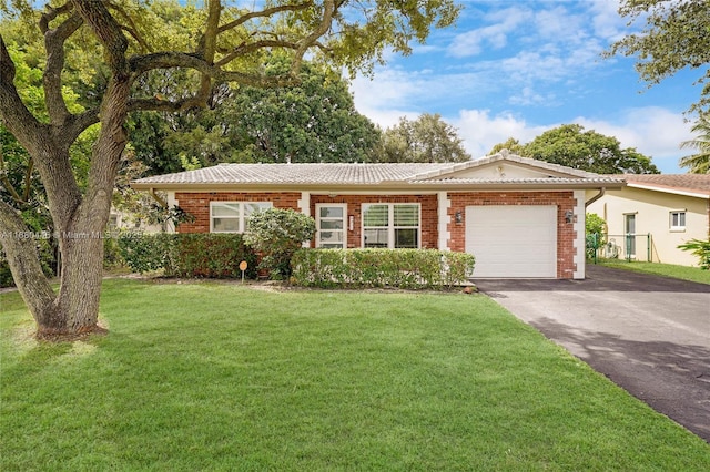 ranch-style home with a front lawn and a garage