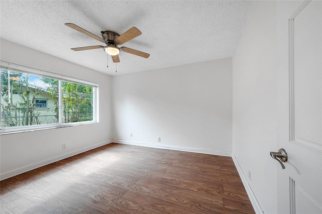 spare room with a textured ceiling, hardwood / wood-style flooring, and ceiling fan