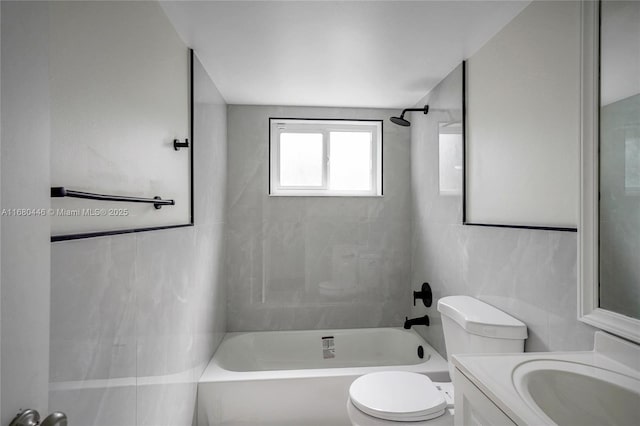 full bathroom featuring vanity, toilet, tile walls, and  shower combination