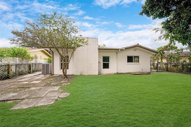 back of house with a yard