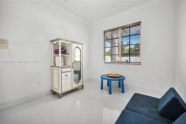 living area featuring ornamental molding and light tile patterned floors