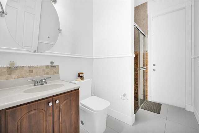 bathroom with vanity, toilet, tile patterned flooring, and an enclosed shower