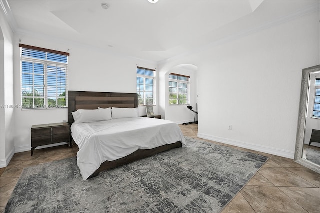 bedroom featuring crown molding