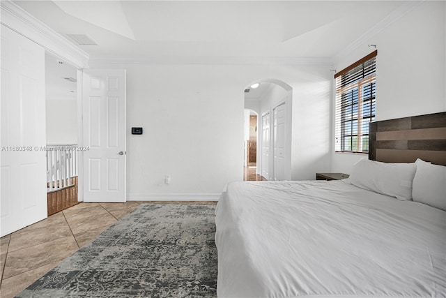 bedroom with ornamental molding