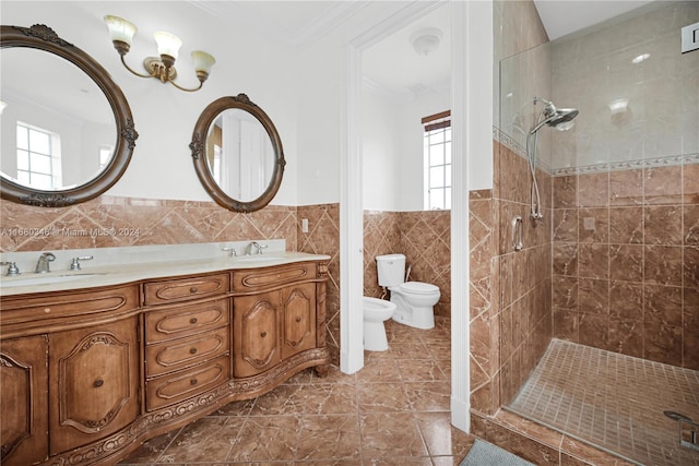 bathroom with toilet, a bidet, vanity, tile walls, and walk in shower