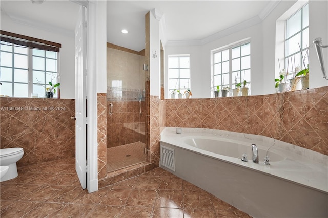 bathroom featuring separate shower and tub, ornamental molding, toilet, and plenty of natural light