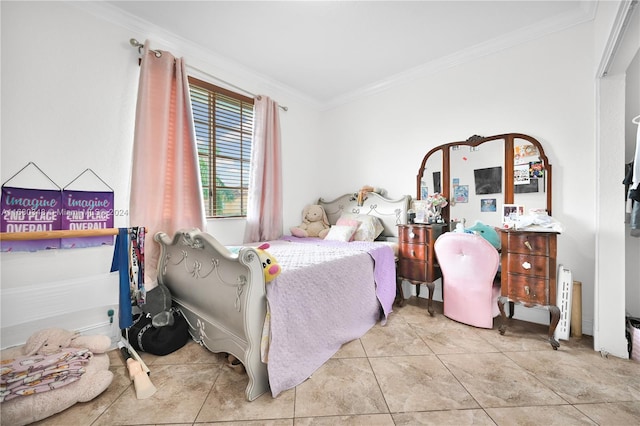 bedroom with crown molding and light tile patterned flooring