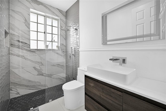 bathroom featuring vanity, tile patterned floors, toilet, and an enclosed shower